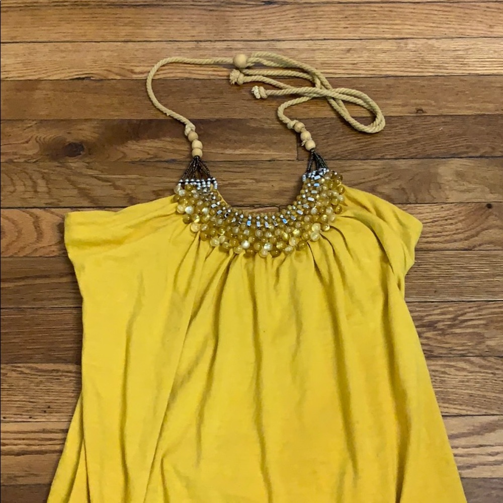 Yellow tank with rope tie